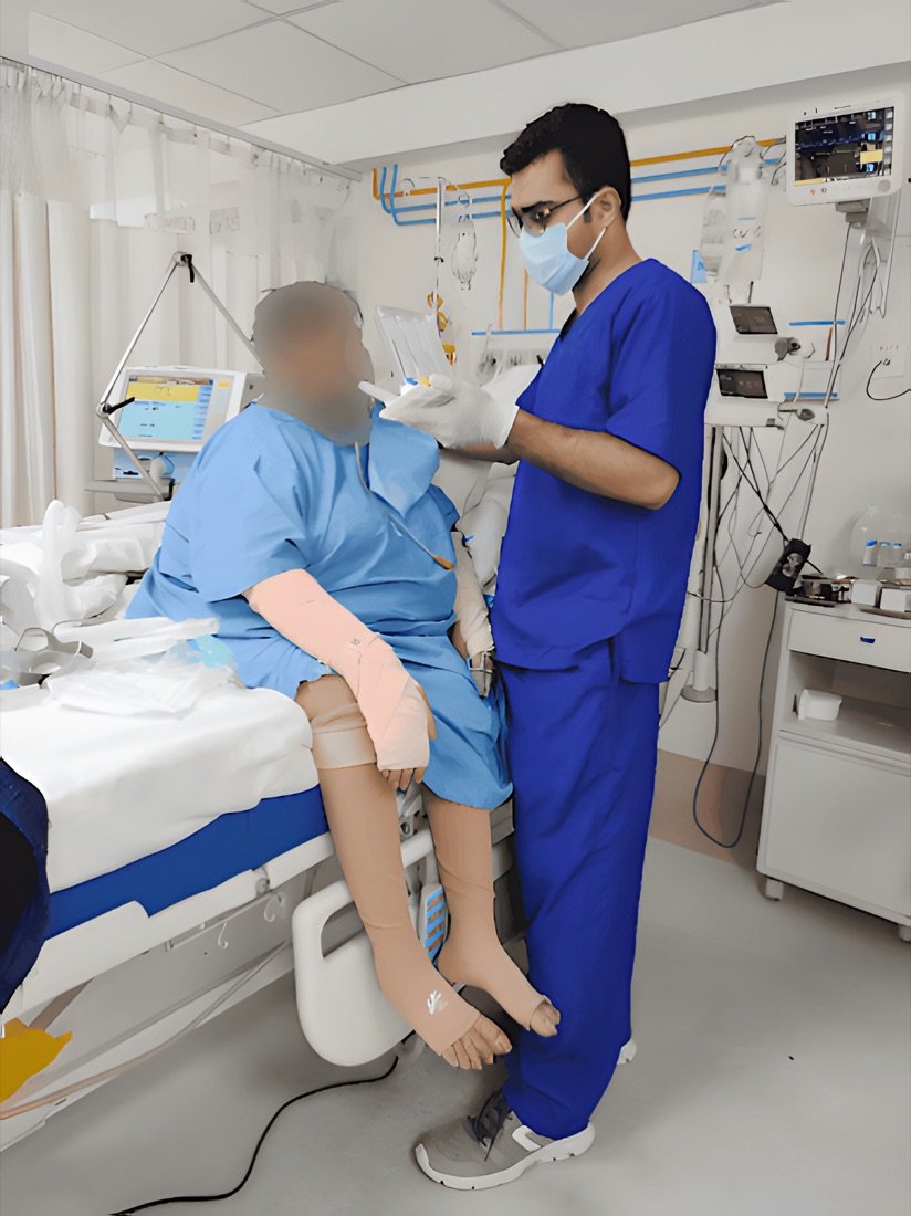 Physiotherapist assessing a patient at the bedside at Physiotrix, Behala