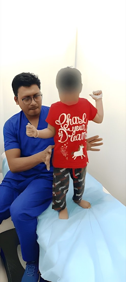 Physiotherapist guiding a child through personalised movement therapy